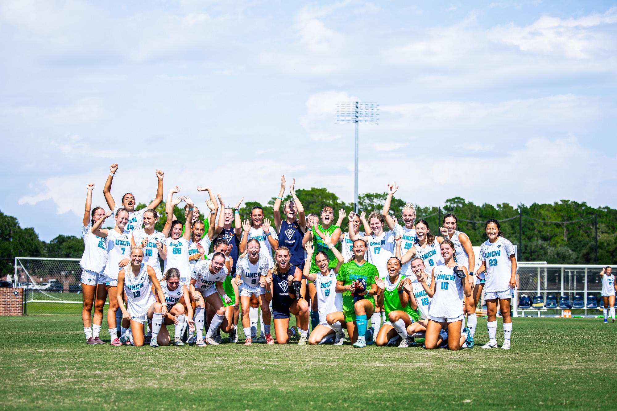 Women's Soccer team celebration after win over High Point