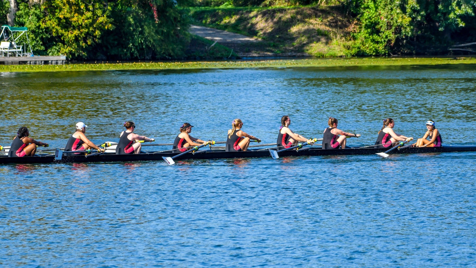 Women's Crew Varsity 8+ boat in the water