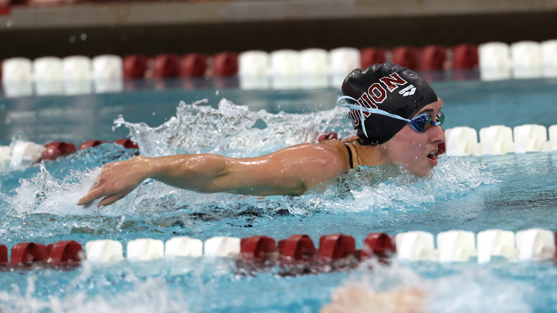 women's swimmer swimming the butterfly