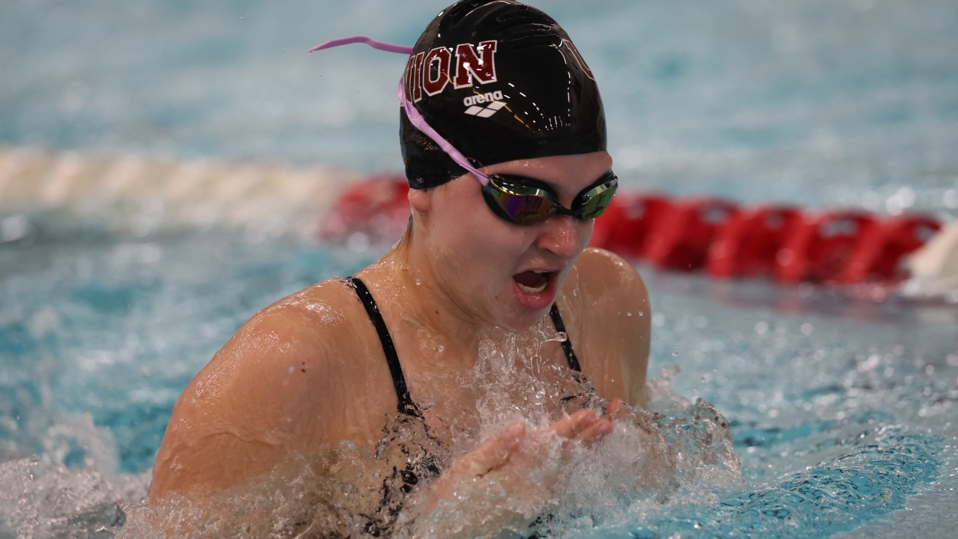 a women's volleyball player doing the breaststroke