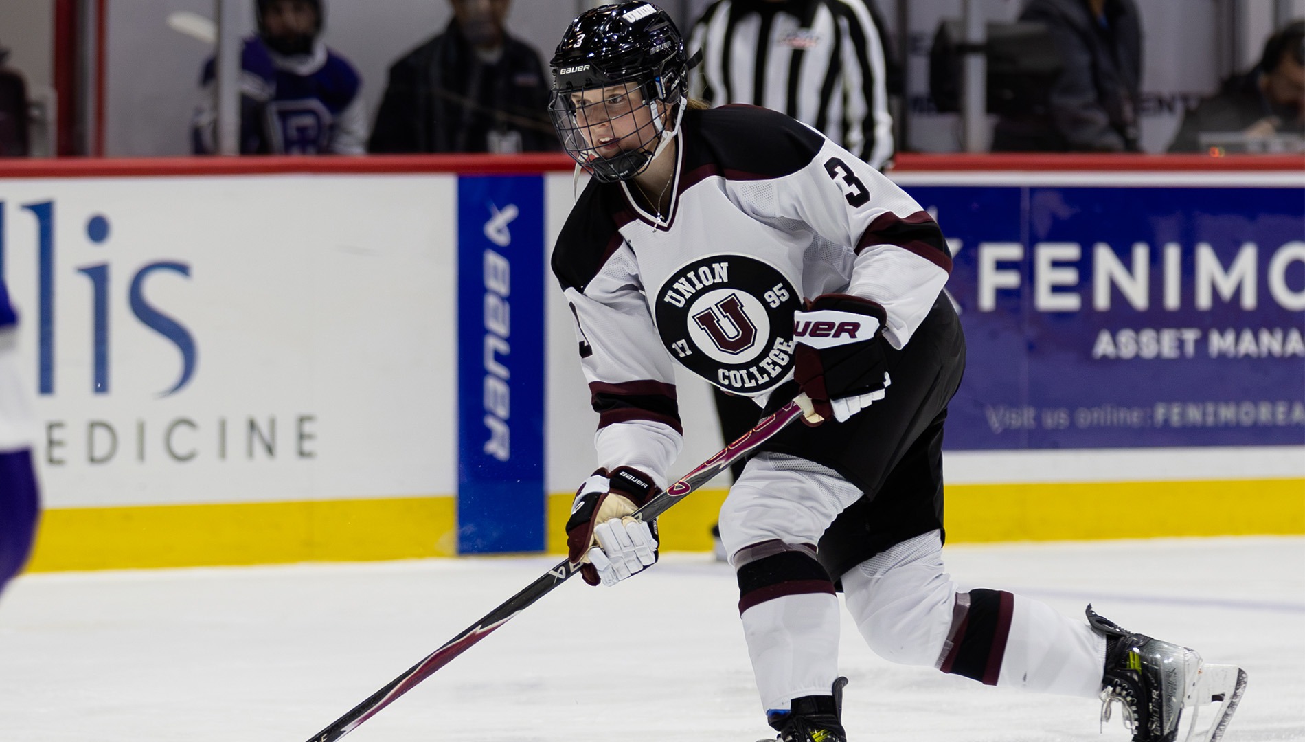 Womens Hockey Player Attacking thr puck