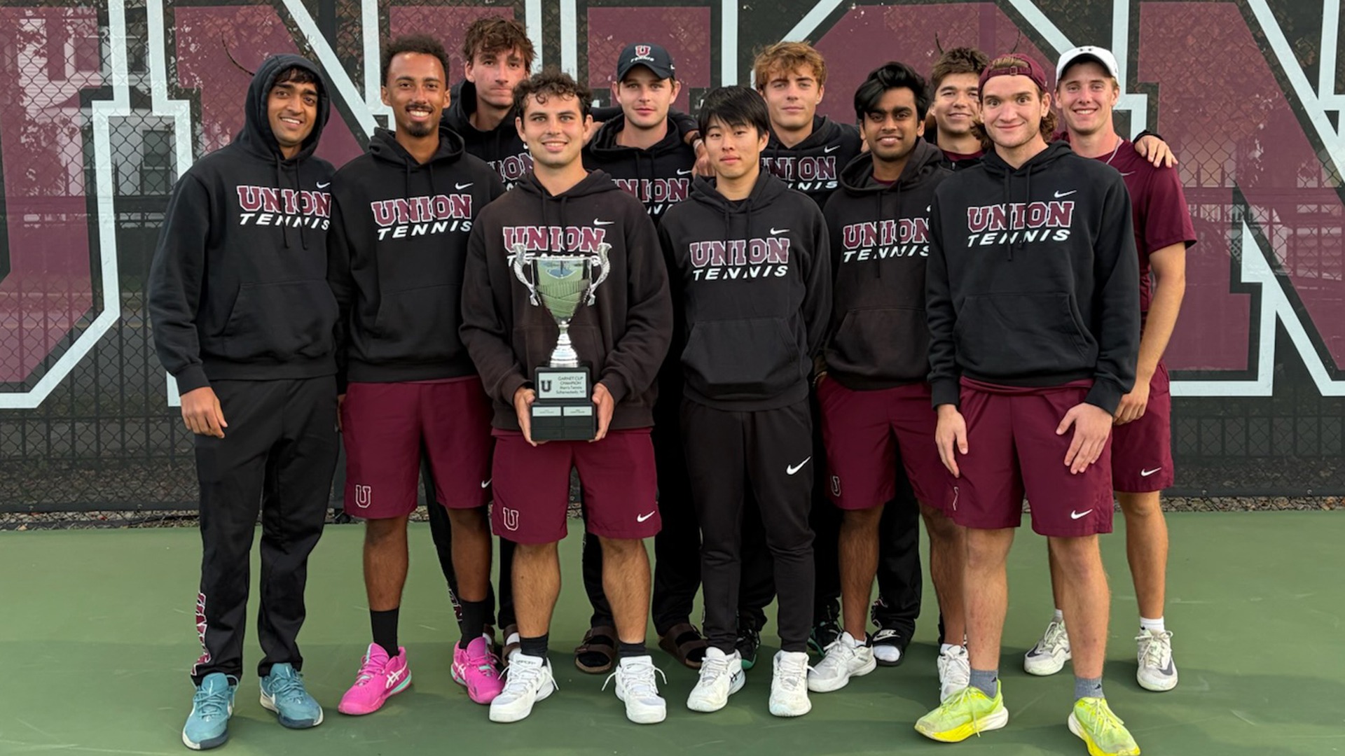 Members of the Union men's tennis team holding the Garnet Cup trophy.