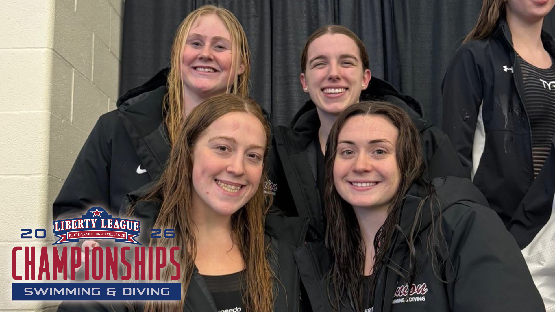 four women's swimmer wearing black coats, with two swimmers in the back and two swimmers up front, smiling at the camera, with the 2026 Liberty League Swim Championship logo in the bottom left corner