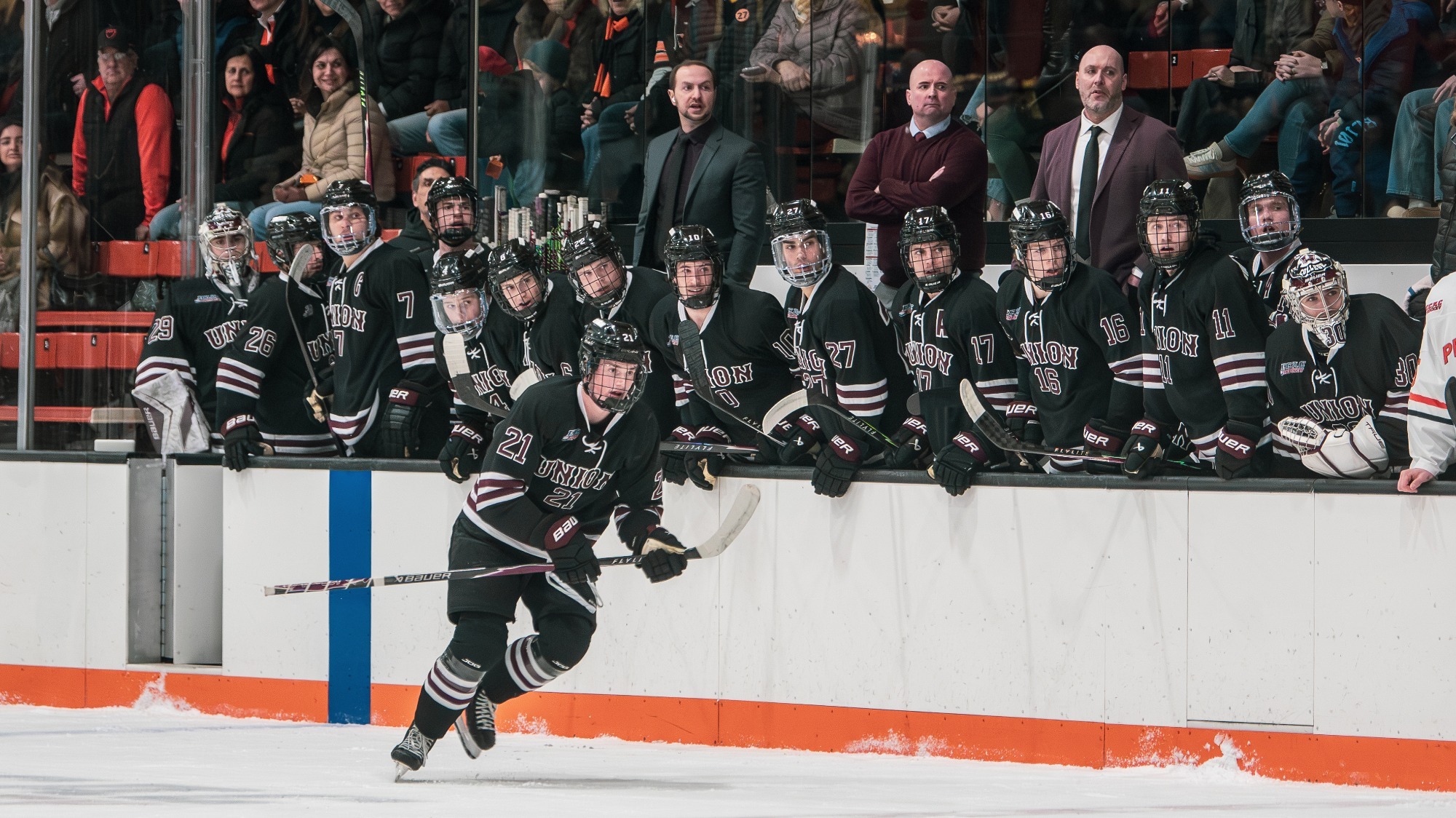 men's hockey team on the bench