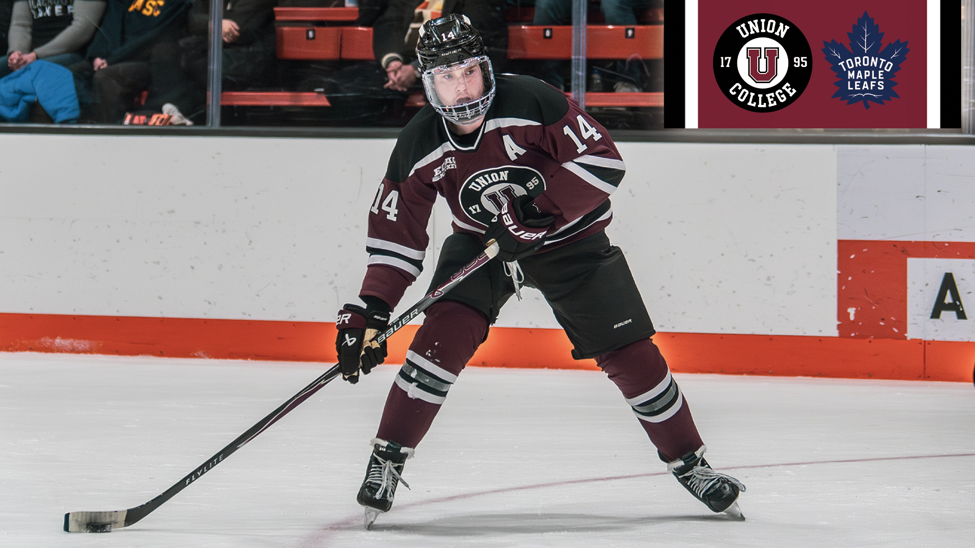 photo of a Union men's hockey player wearing a garnet-colored jersey with the Union logo and the Toronto Maple Leafs logo in the top-right corner