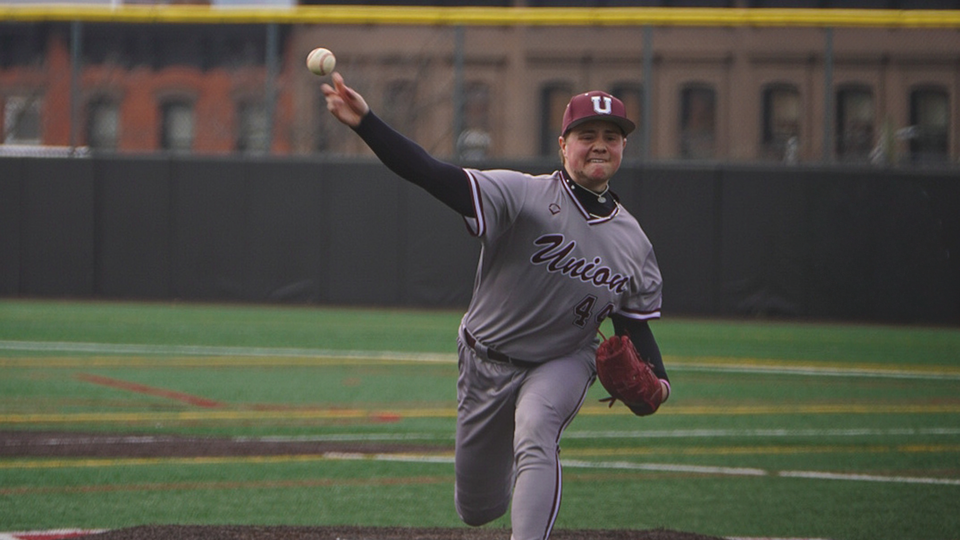 right-handed baseball pitcher releasing a pitch