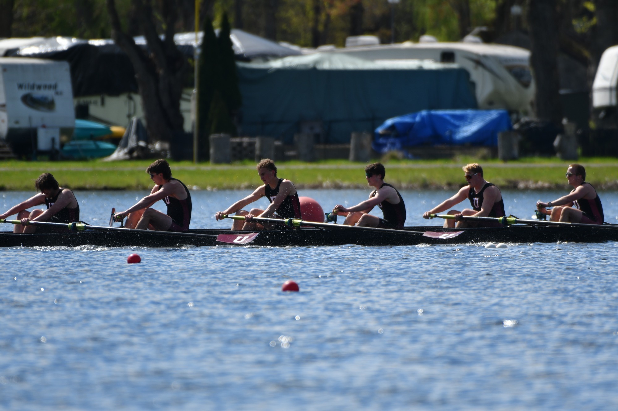 a men's crew boat on the water