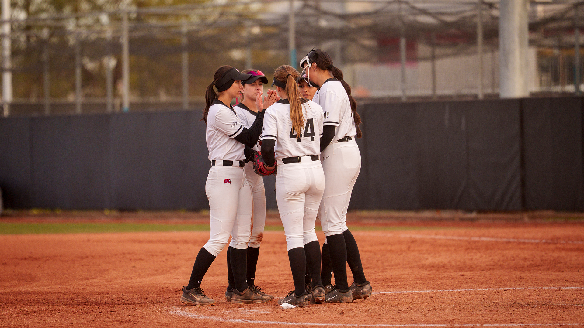 Softball infield huddle