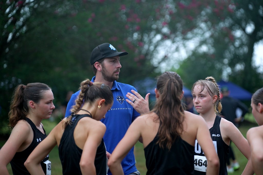 Clayton O'Callaghan and the Women's Cross Country Huddle