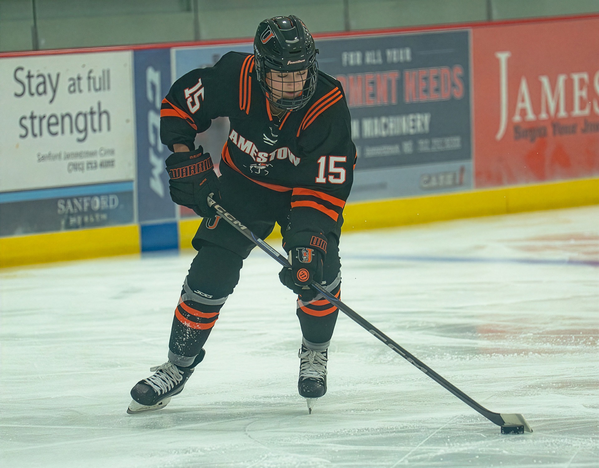 Alivia Tilbury carries the puck in a game against Arizona State earlier this season