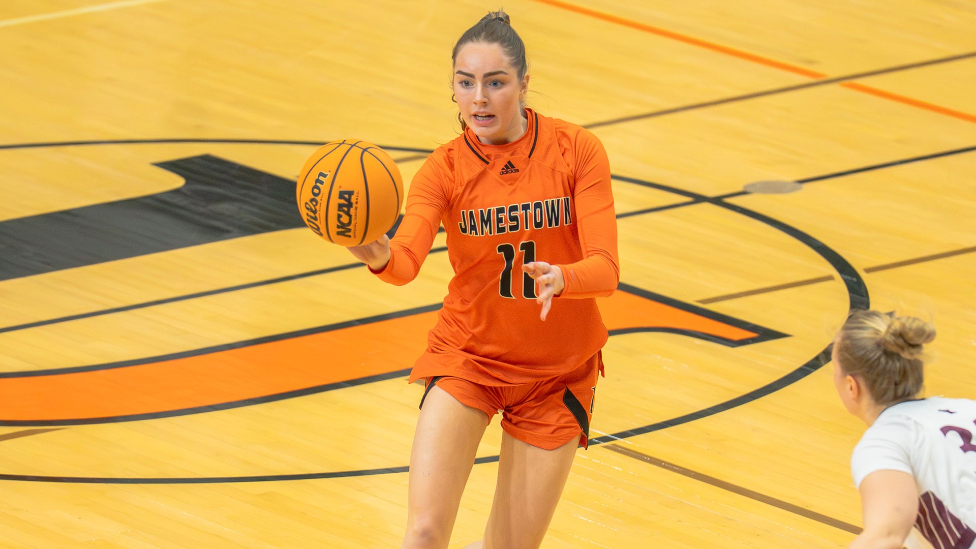 UJ's Julia Thoms makes a pass against UMD on Saturday, December 13, 2025 at Harold Newman Arena