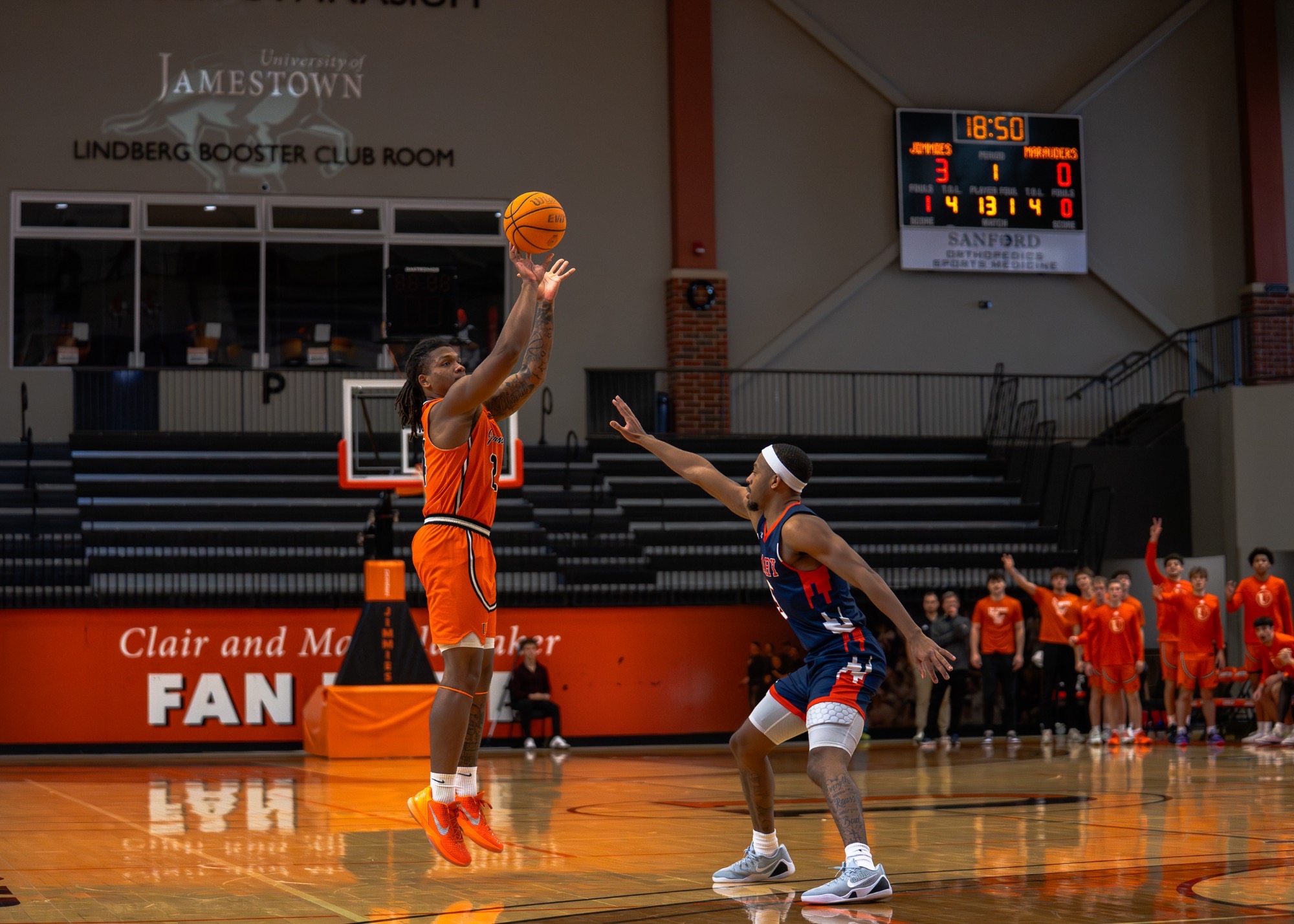 Antony Walters jumps up to hit a three pointer in front of a UMary defender in 2OT victory on December 6, 2025 in the Harold Newman Arena