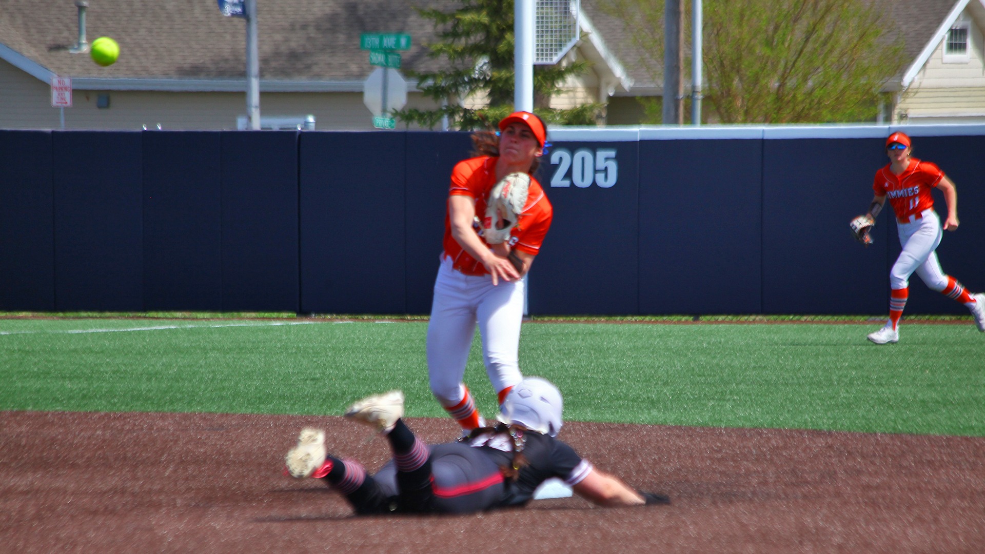 Tori Olson makes the throw to first against VCSU Friday in the NSAA tournament