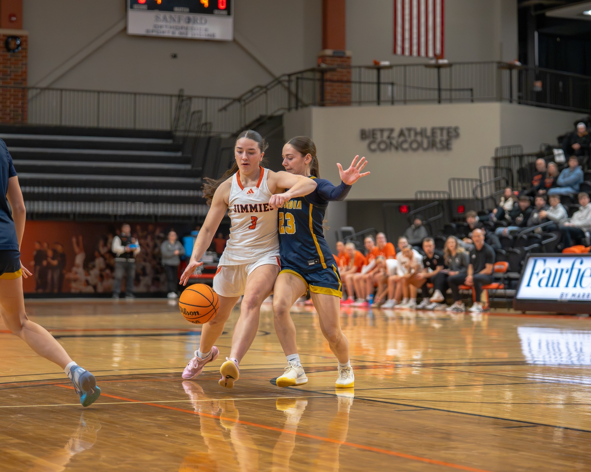 UJ's Hali Savela dribbles past CSP's Lydia Haack during Friday's game at Harold Newman Arena.