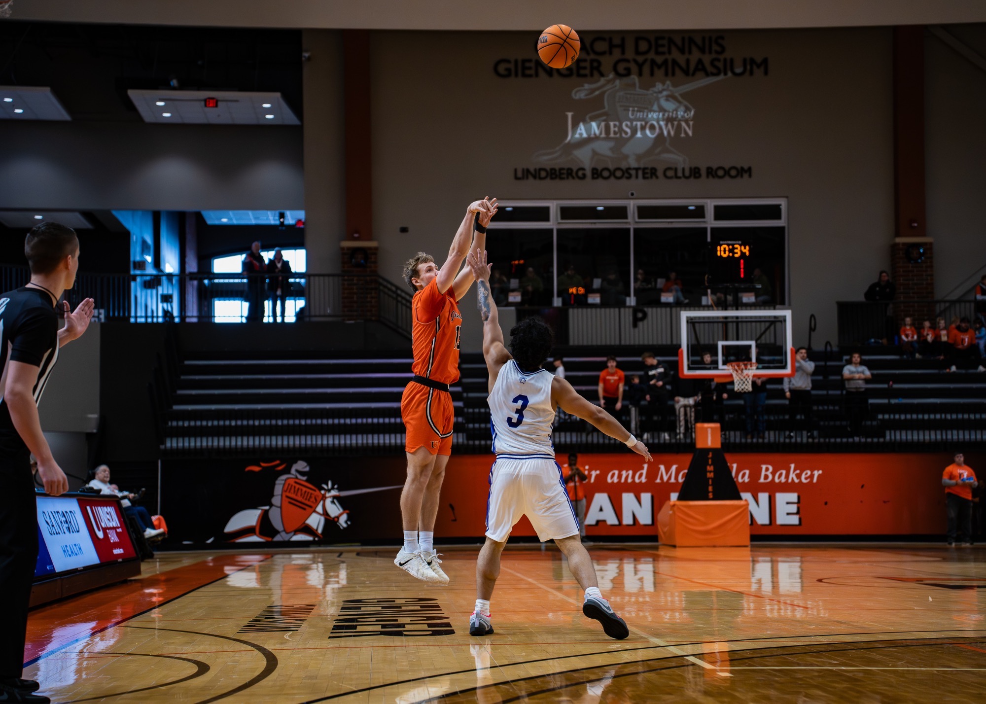 Jimmie #13 Cole Glasgow shoots over Winona St. defender #3 Jaron Crews on January 17, 2026 in the Harold Newman Arena