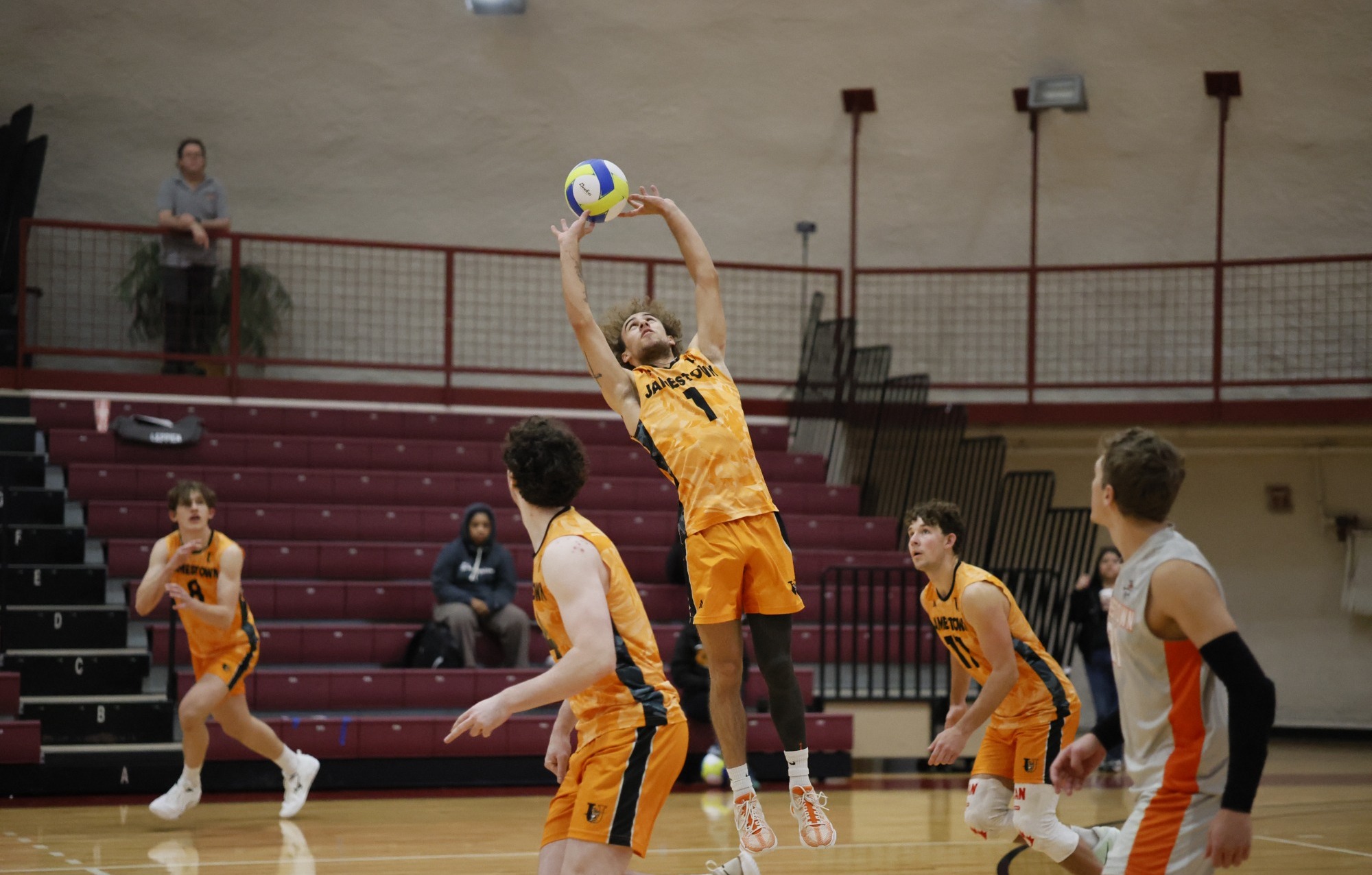 #1 Kaden Jenkins (UJ) performing a jump set to his attackers