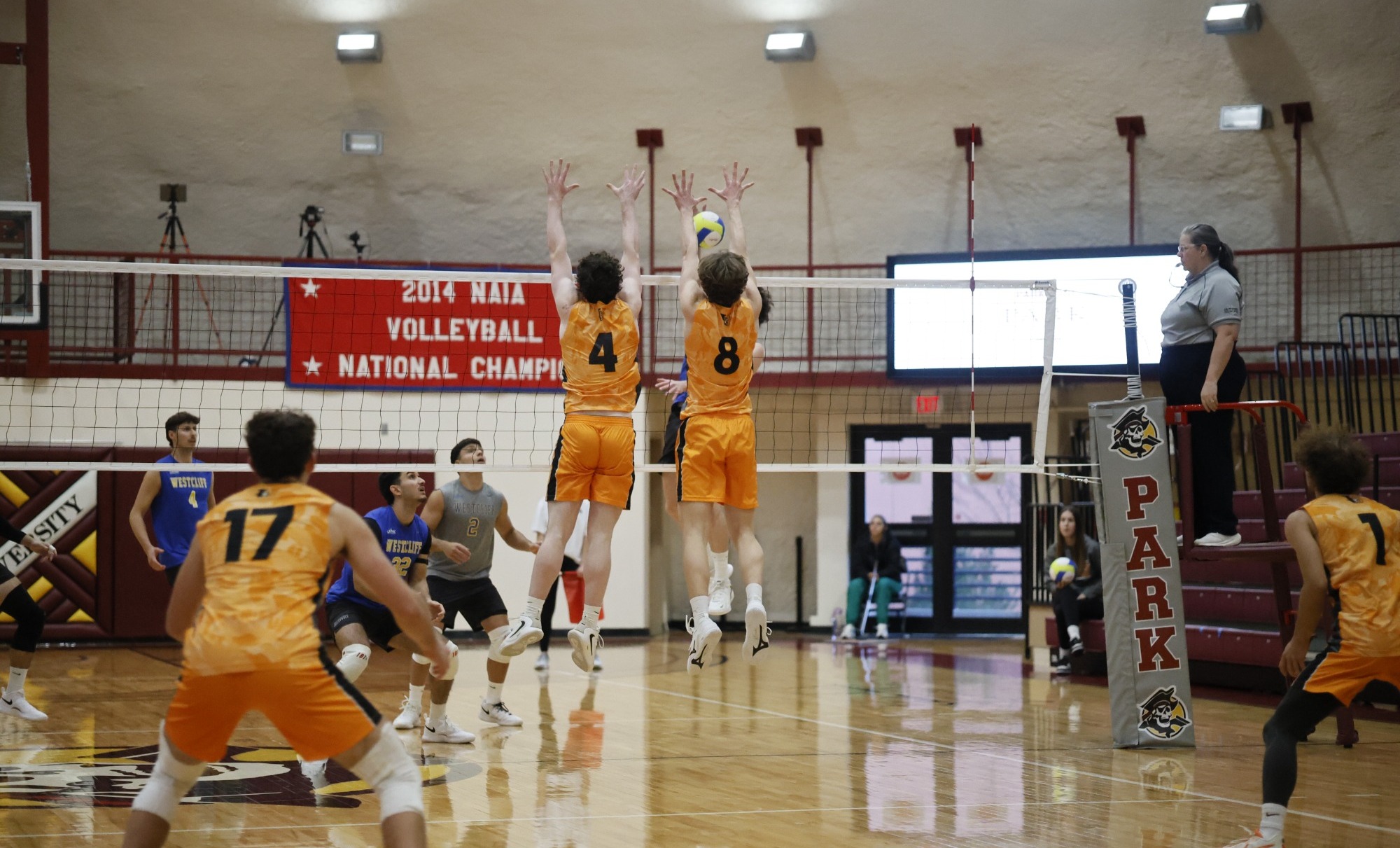 #4 Brady Leppien-Christensen (UJ) and #8 Chase Hawkinson (UJ) double blocking an attack from the opposing team