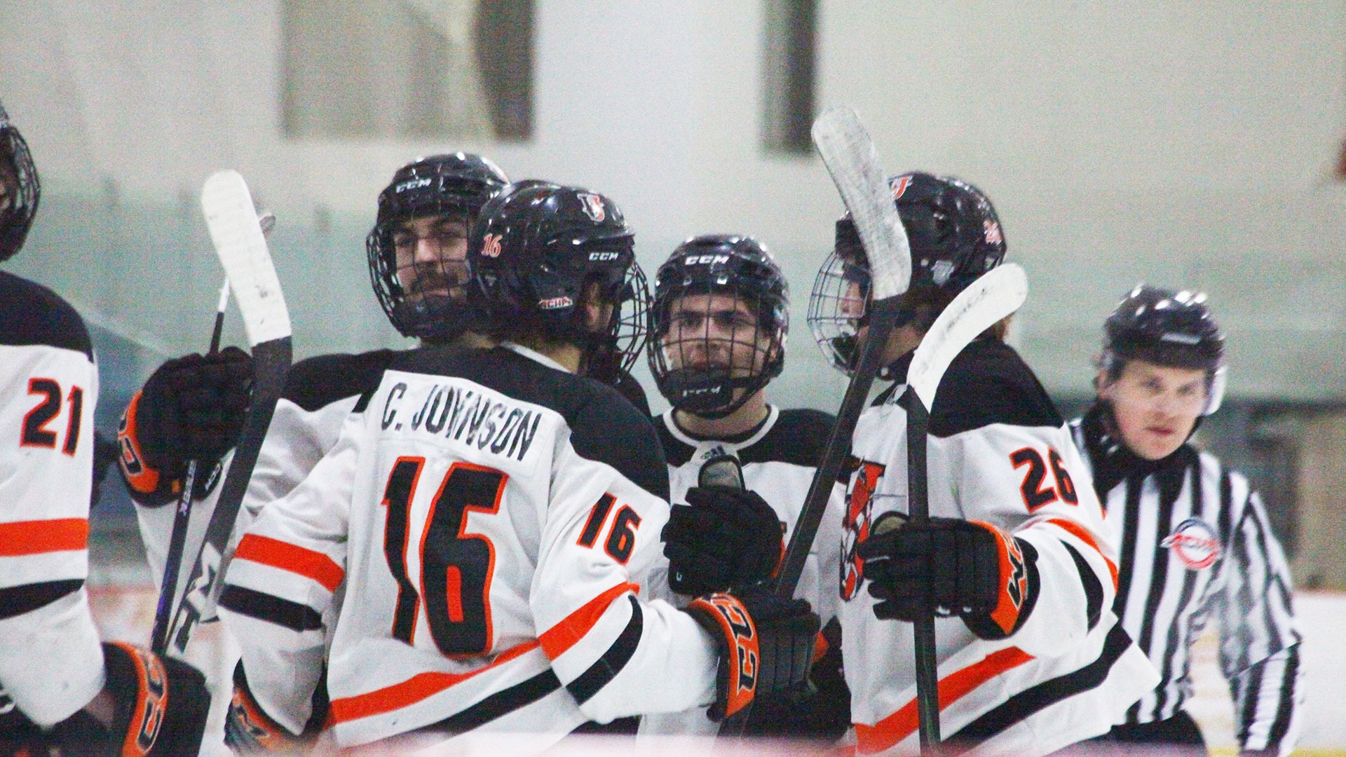 A group of Jimmie hockey players celebrate after a goal against UMary on January 23, 2026
