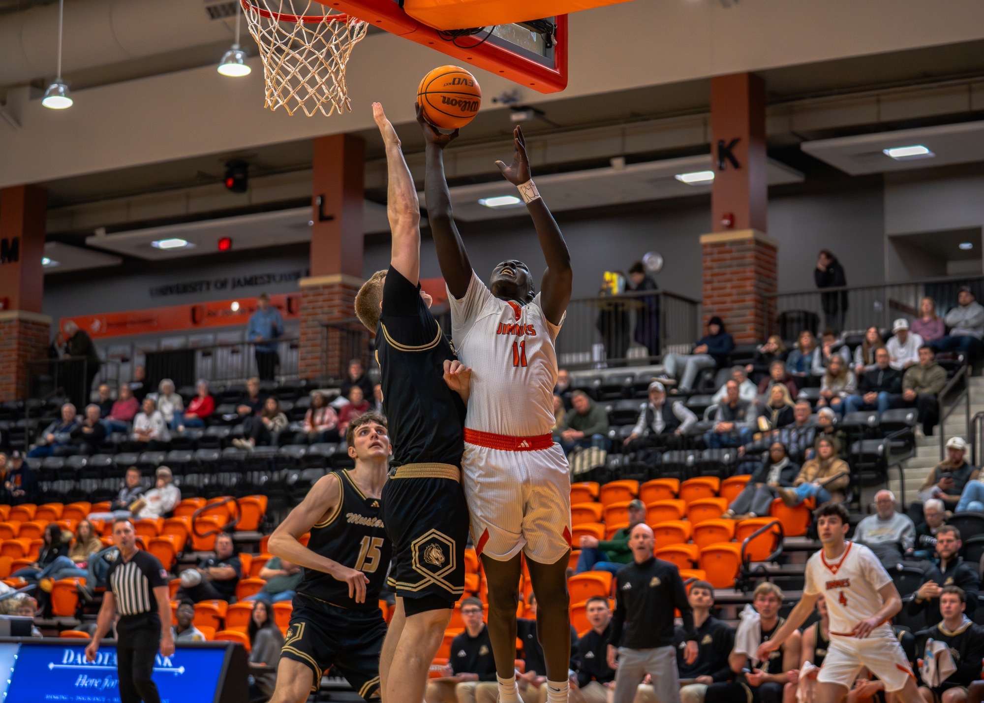 #11 Thomas Diew shoots layup over SMSU defender on January 30, 2026 at the Harold Newman Arena 