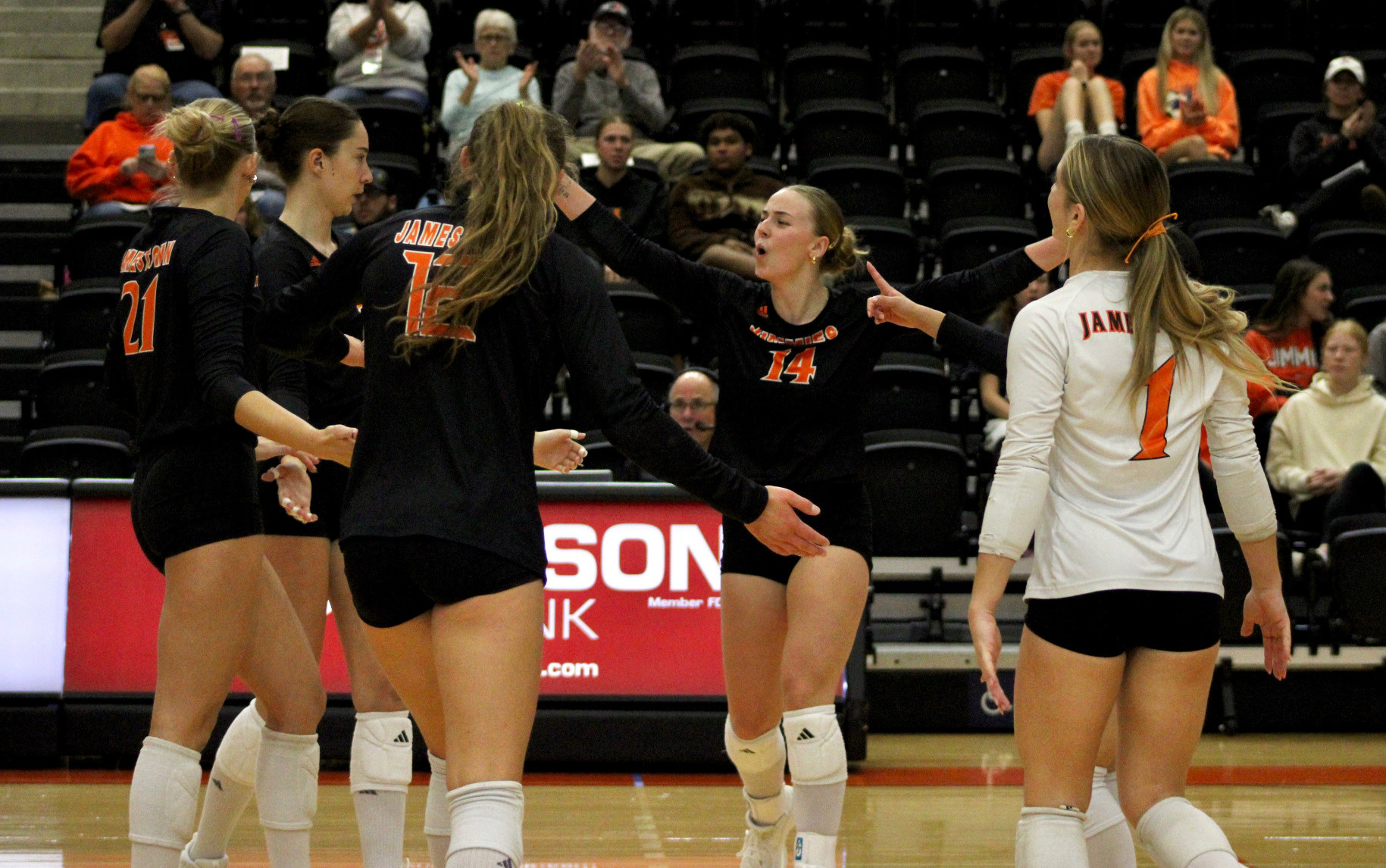 Jimmie Volleyball celebrates after a point against St. Cloud (10/17)