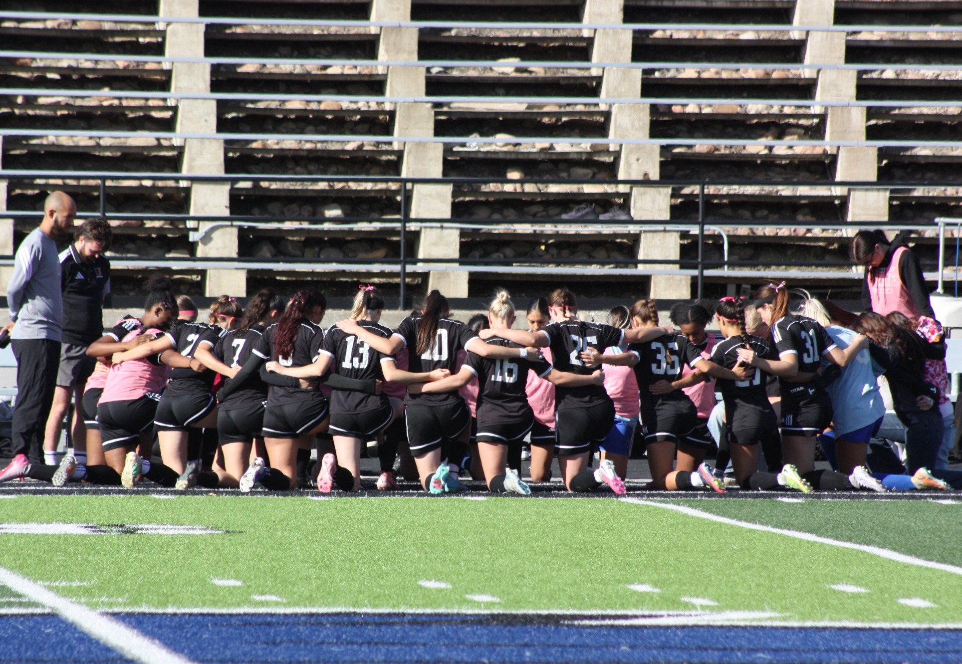 Pregame huddle for Jamestown women's soccer against Augie (10/18)