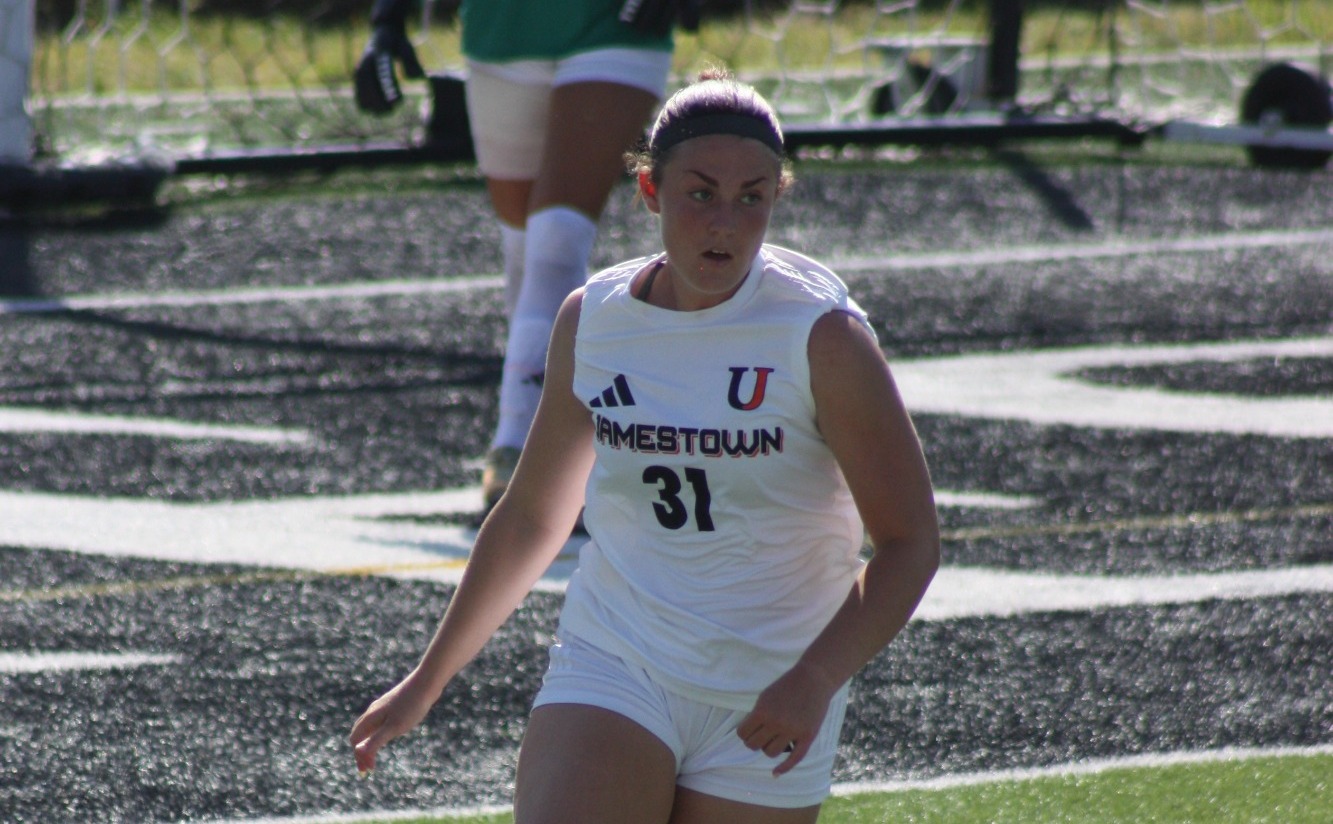 Riley Aldrich looks up the field in an exhibition game against Dakota Weslyan