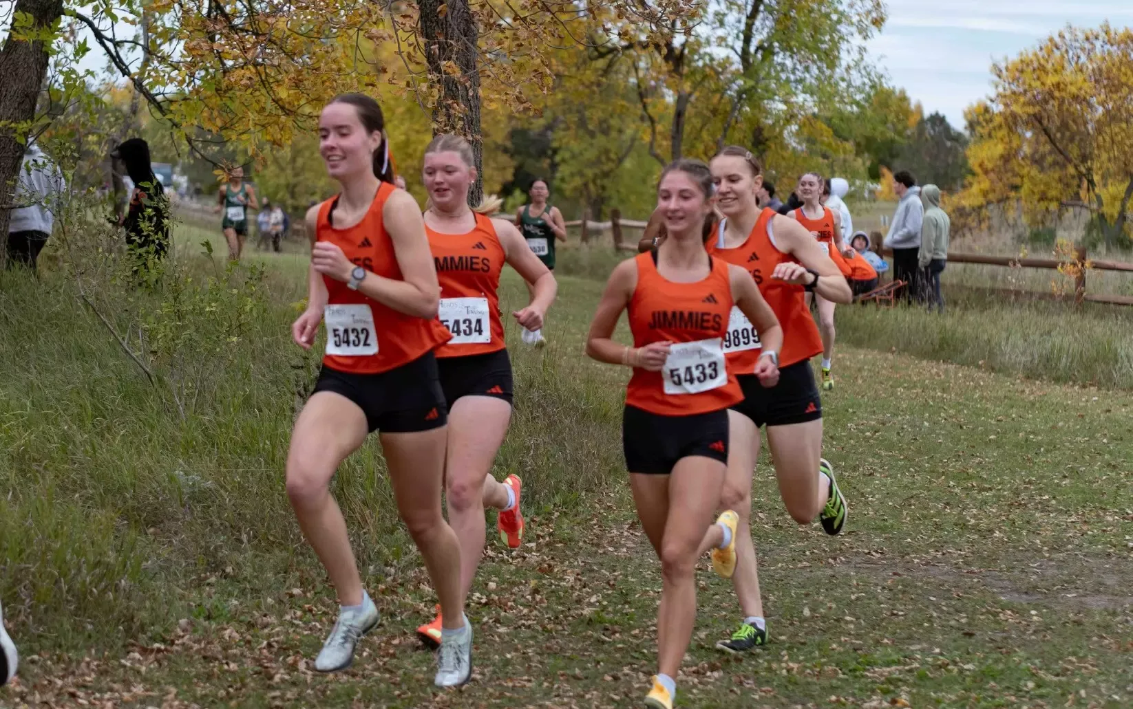 A group of Jimmie runners makes their way along the course during the UJ Invitational on Friday