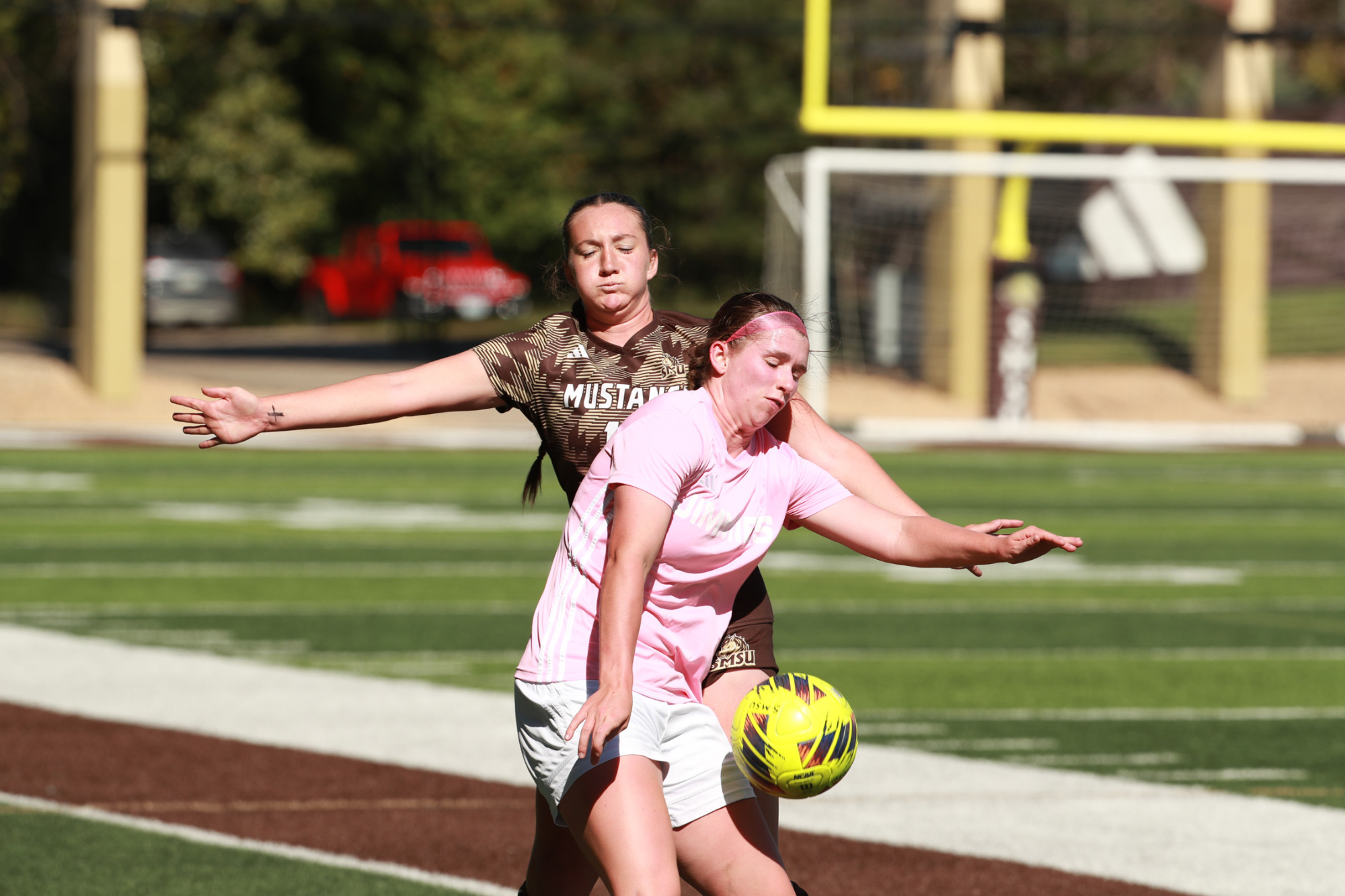 Bre Oettle battles for possession against an SMSU defender (10/4)