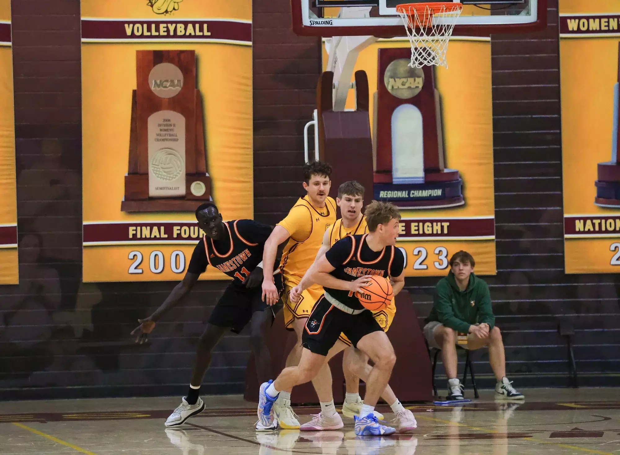 UJ #13 Cole Glasgow pivots with ball against Duluth defender in Duluth, Minn. on Thursday February 12, 2026