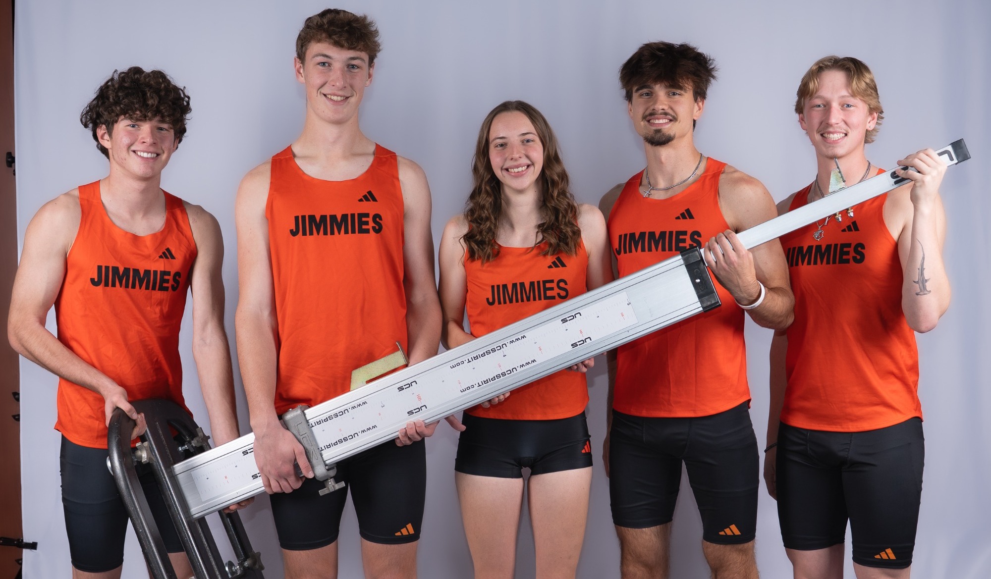 UJ Track & Field Athletes posing with a high jump standard