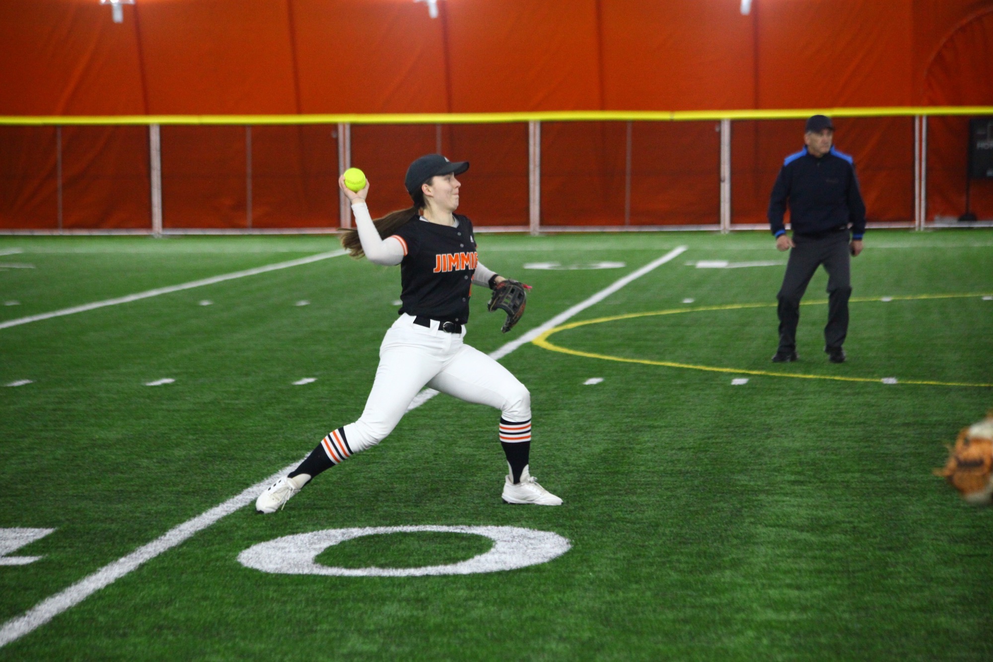 #10 Jamestown Maddie Spaeth reels up to throw and out to first base 