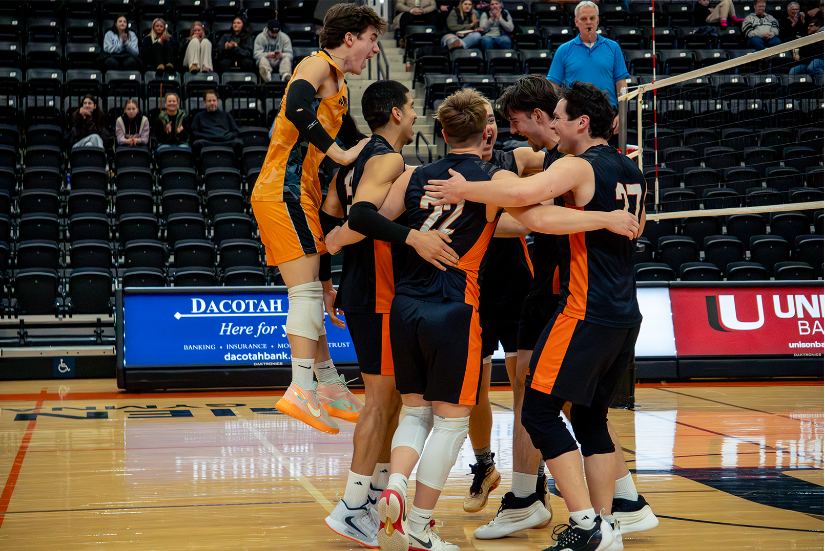 UJ Mens Volleyball team jumping for joy as #11 Kael Calder earns a solo block