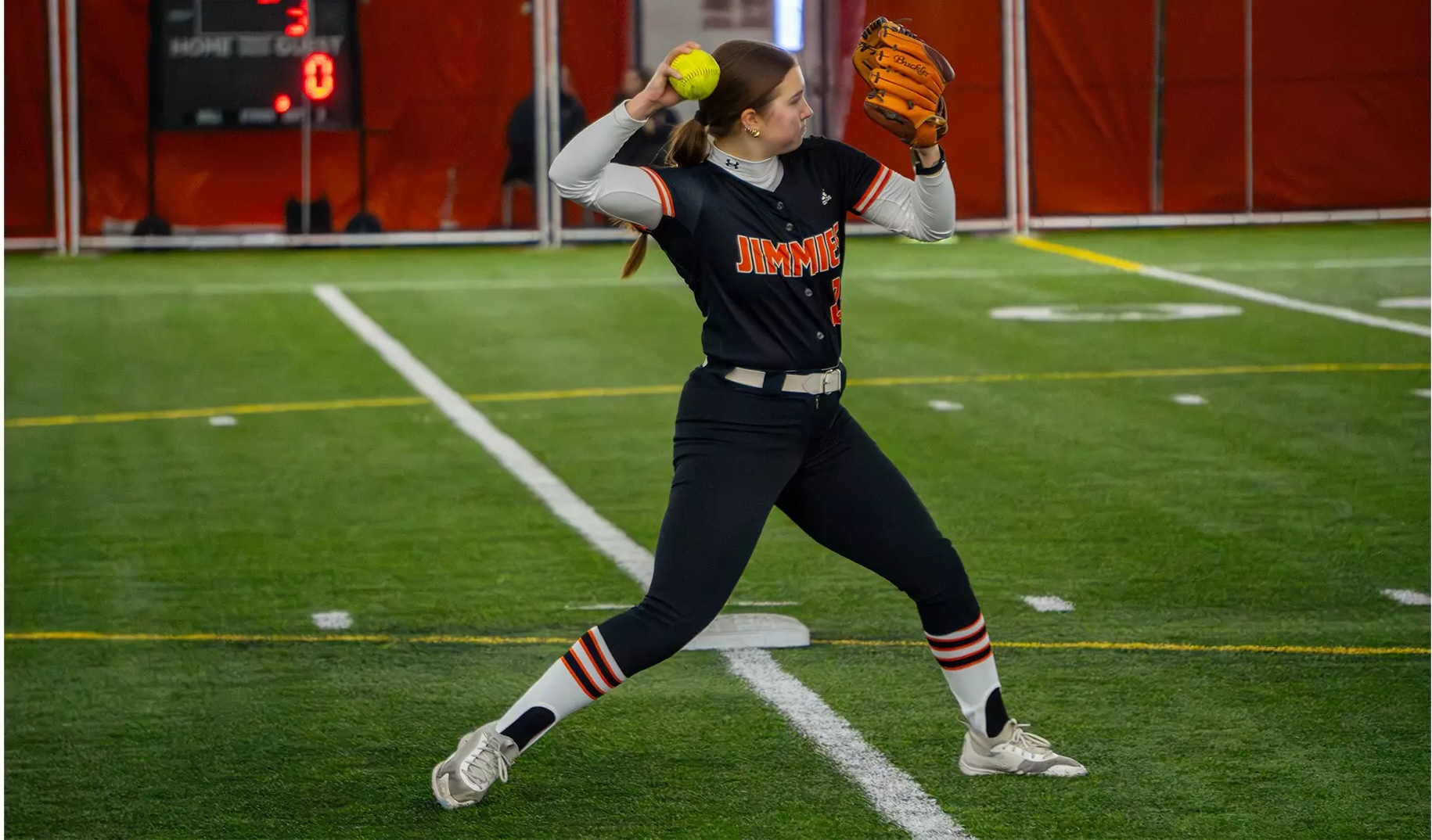 UJ #23 Jorja Hainsworth reels back to make a throw to first base 