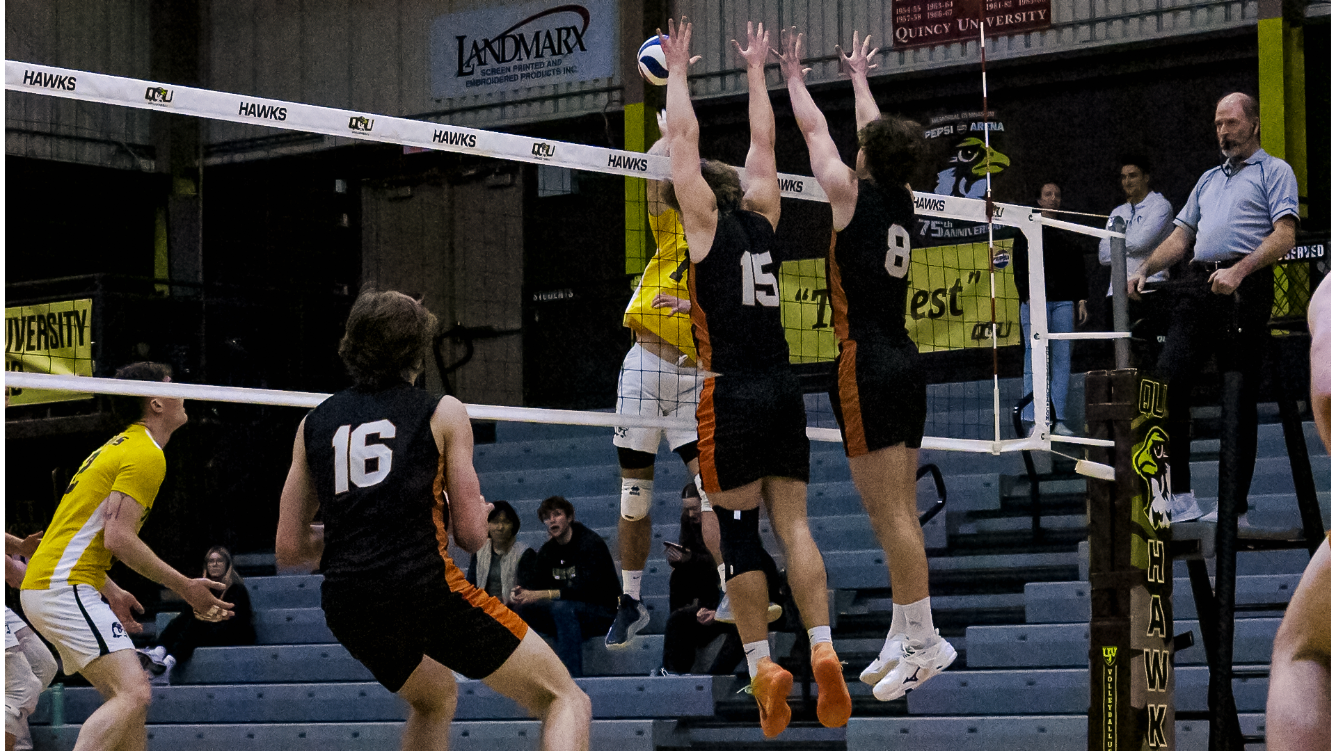 #15 Ethan Carroll #8 Chase Hawkinson double blocking an attack attempt from the opposing team