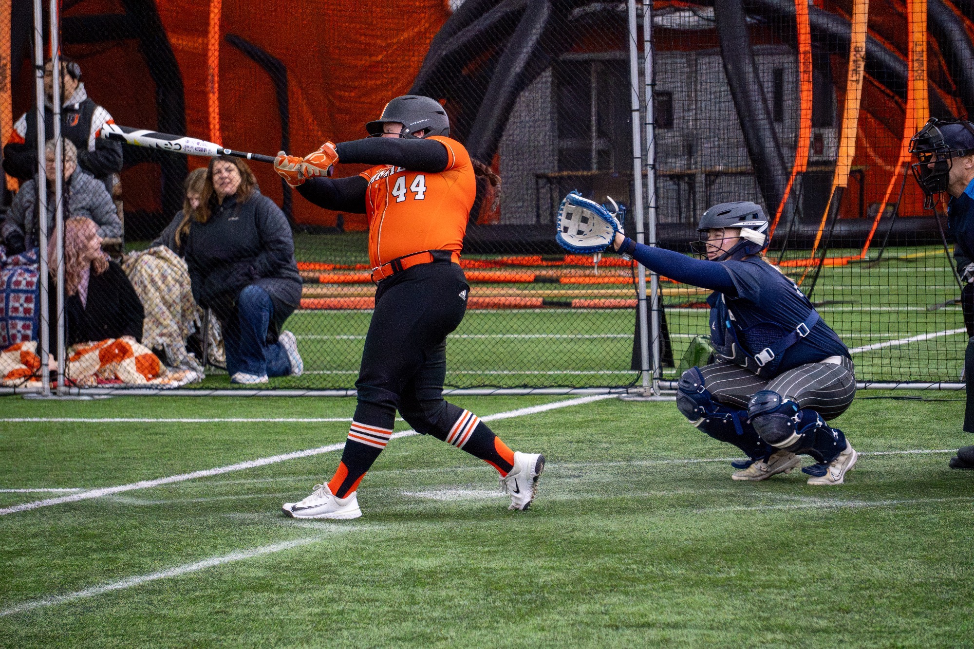 #44 Hope Ransome swings the bat and makes contact with the ball in the Nelson Family Bubble against Dickinson State University 