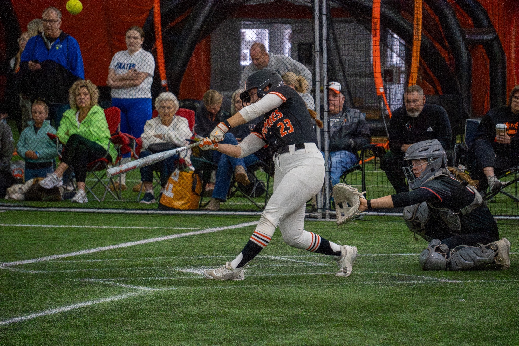 Jamestown #23 Jorja Hainsworth swings the bat and puts the ball into play in their match up with St. Cloud in the Nelson Family Bubble on Saturday March 28