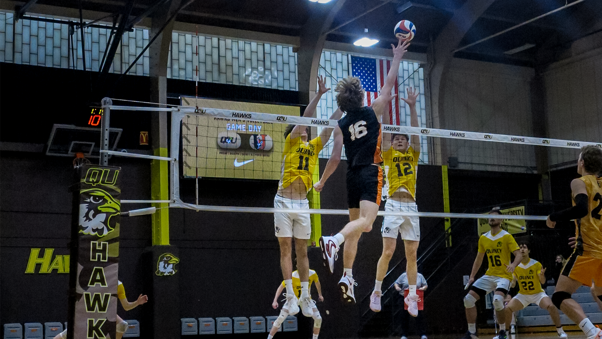 #16 Lucas Soeldner jumping at the net to tip the ball to the opposing team