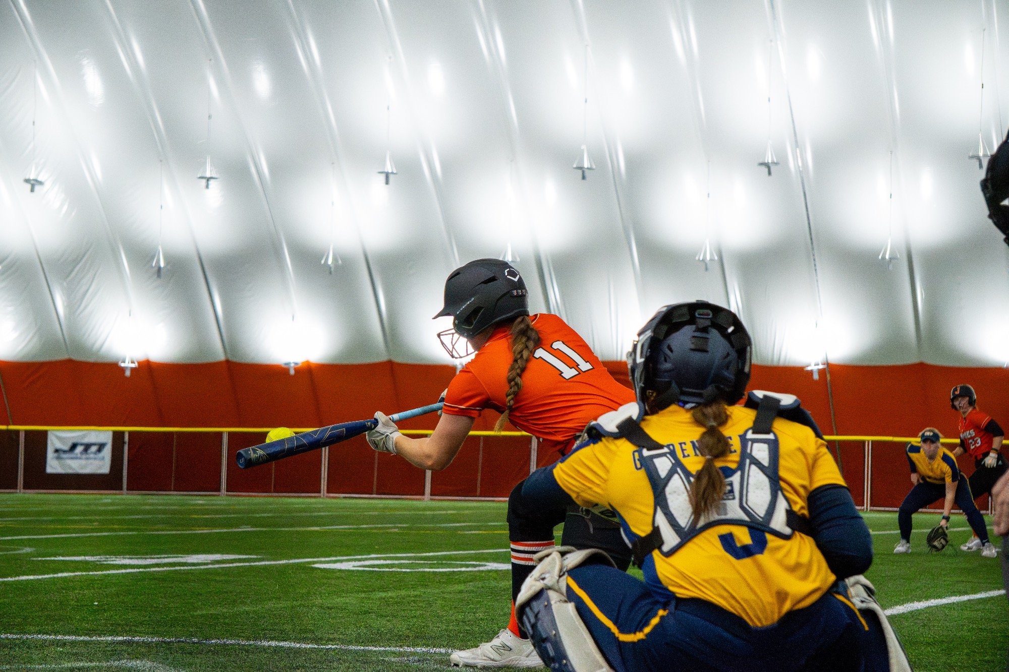 Jamestown #11 Lauren Weigel lays down a bunt in their doubleheader against Concordia St. Paul on March 29 in the Nelson Family Bubble 