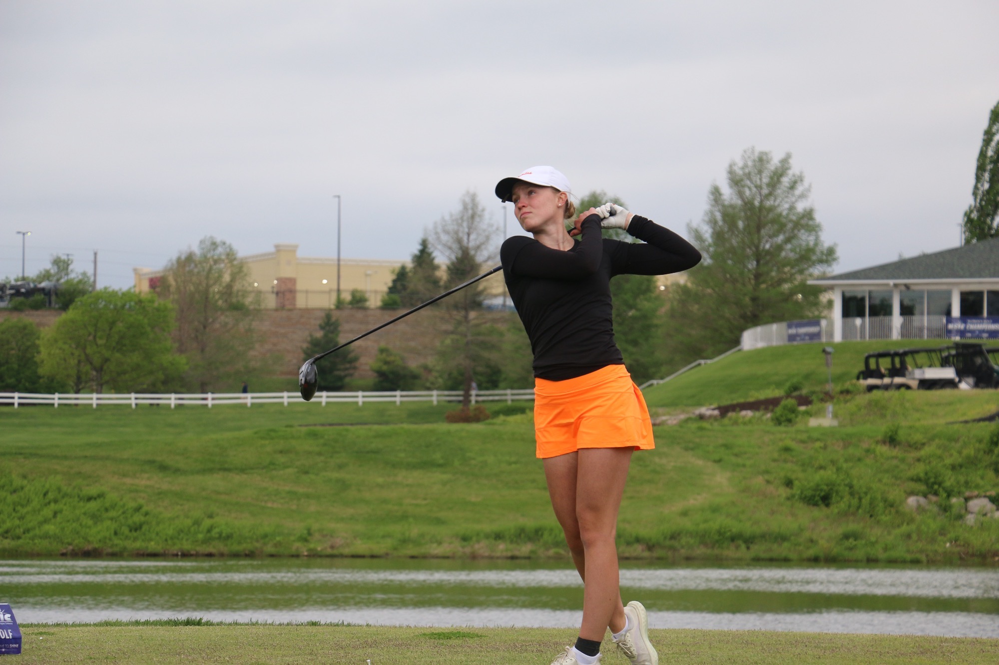 Jamestown Golger KAcie Rexin tees off at a hole in the NSIC Championship in Blue Ridge, MO on April 23, 2026