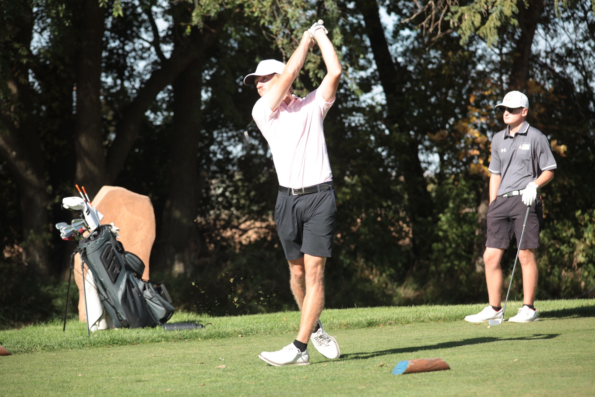 Jamestown golfer Aidan Hall hits the ball off the green at the UJ Invite 
