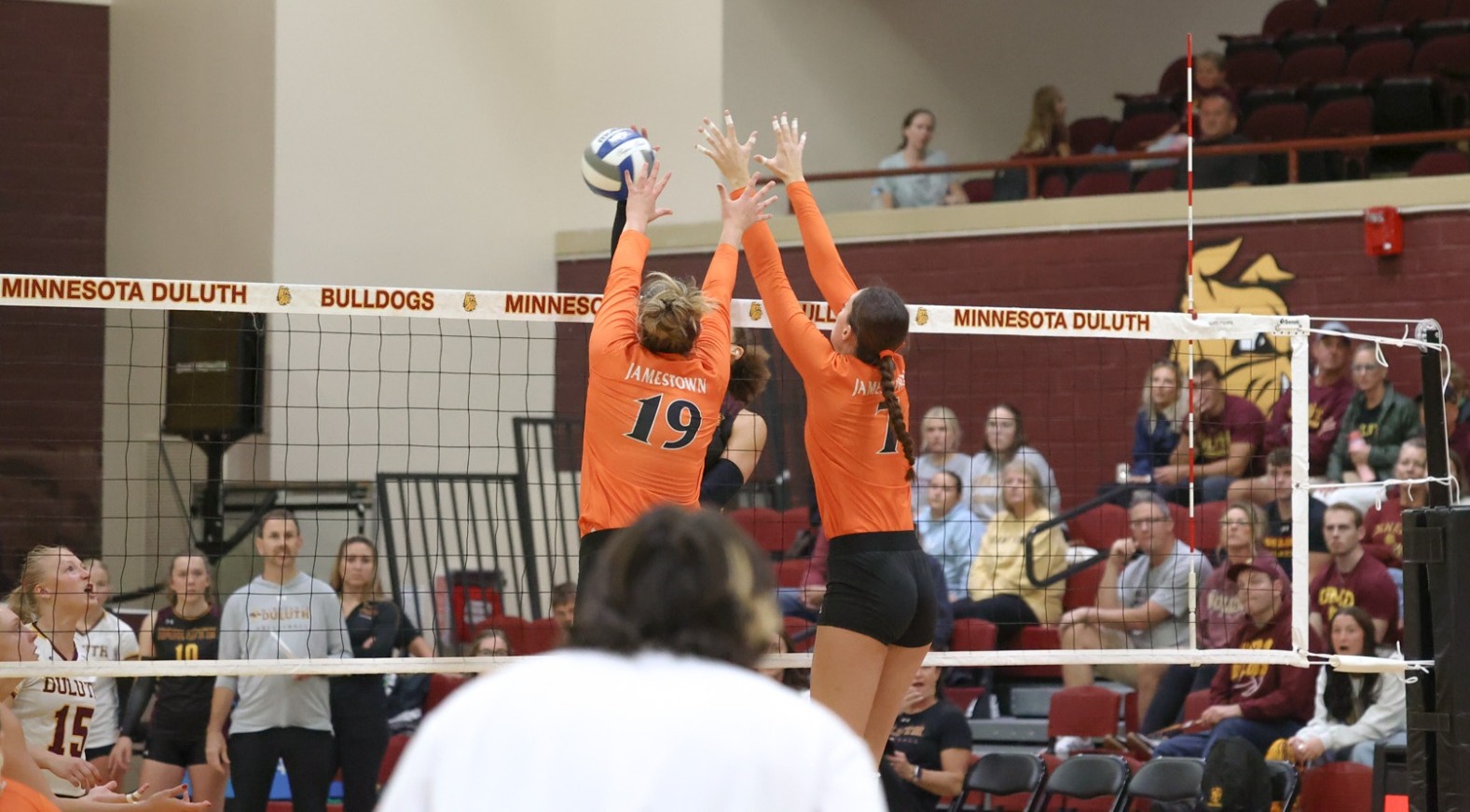 Charlotte Lempka and Caroline Puetz line up for a block against UMD 