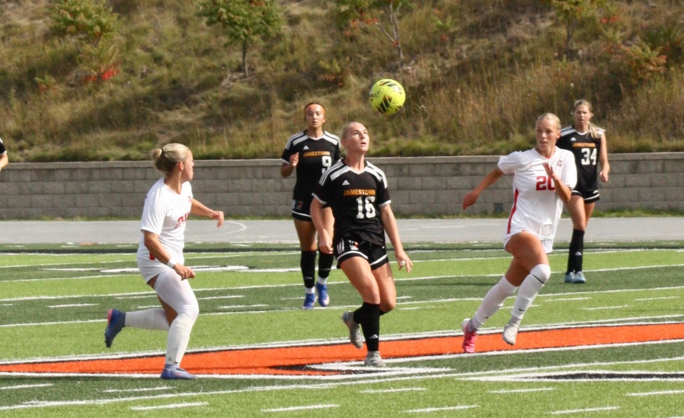 Kyah Gabel battles with a pair of St. Cloud State players for possession 