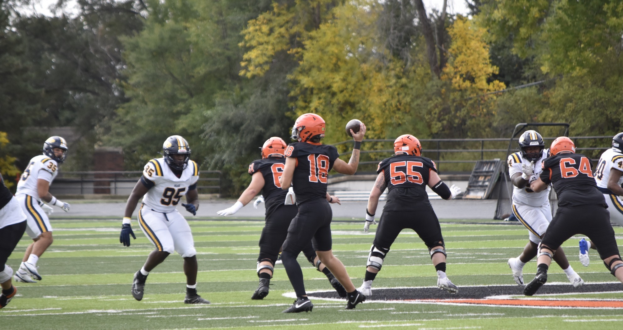 UJ's Jacob Mattick (18) attempts a pass in Saturday's game against Concordia-St. Paul