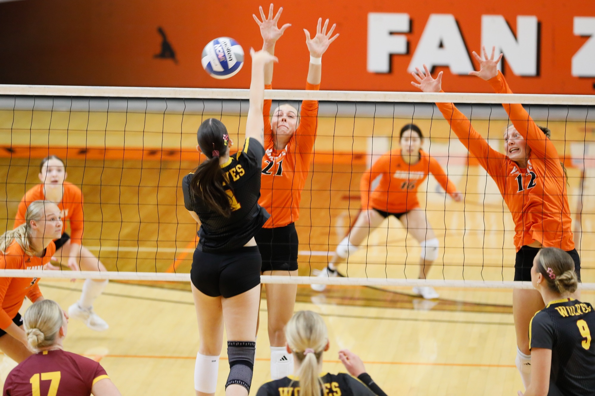 Kyleigh Schopp and Gracie Adamson line up for a block attempt against Northern State