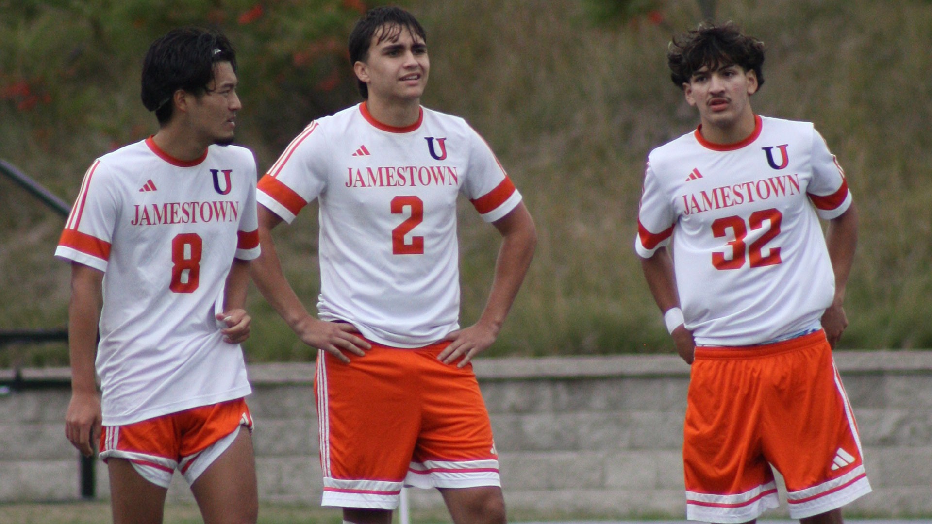 (Left to Right) UJ's Kai Yoshida, Will Tubaro, and Ethan Huerta await resumption of play in a match on September 19 against Dakota Wesleyan
