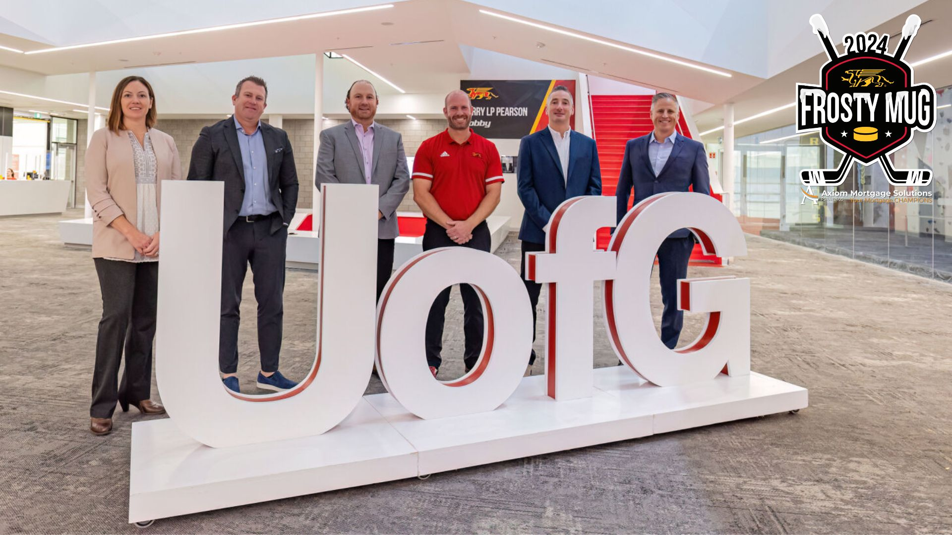 Gryphon Athletic Centre lobby. From left Mary Casagrande from U of G, Nick Hishon, from Axiom Dylan Furlong from Axiom, Scott McRoberts from U of G, Alec Bowes from Axiom, and Doug Adlam from Axiom.