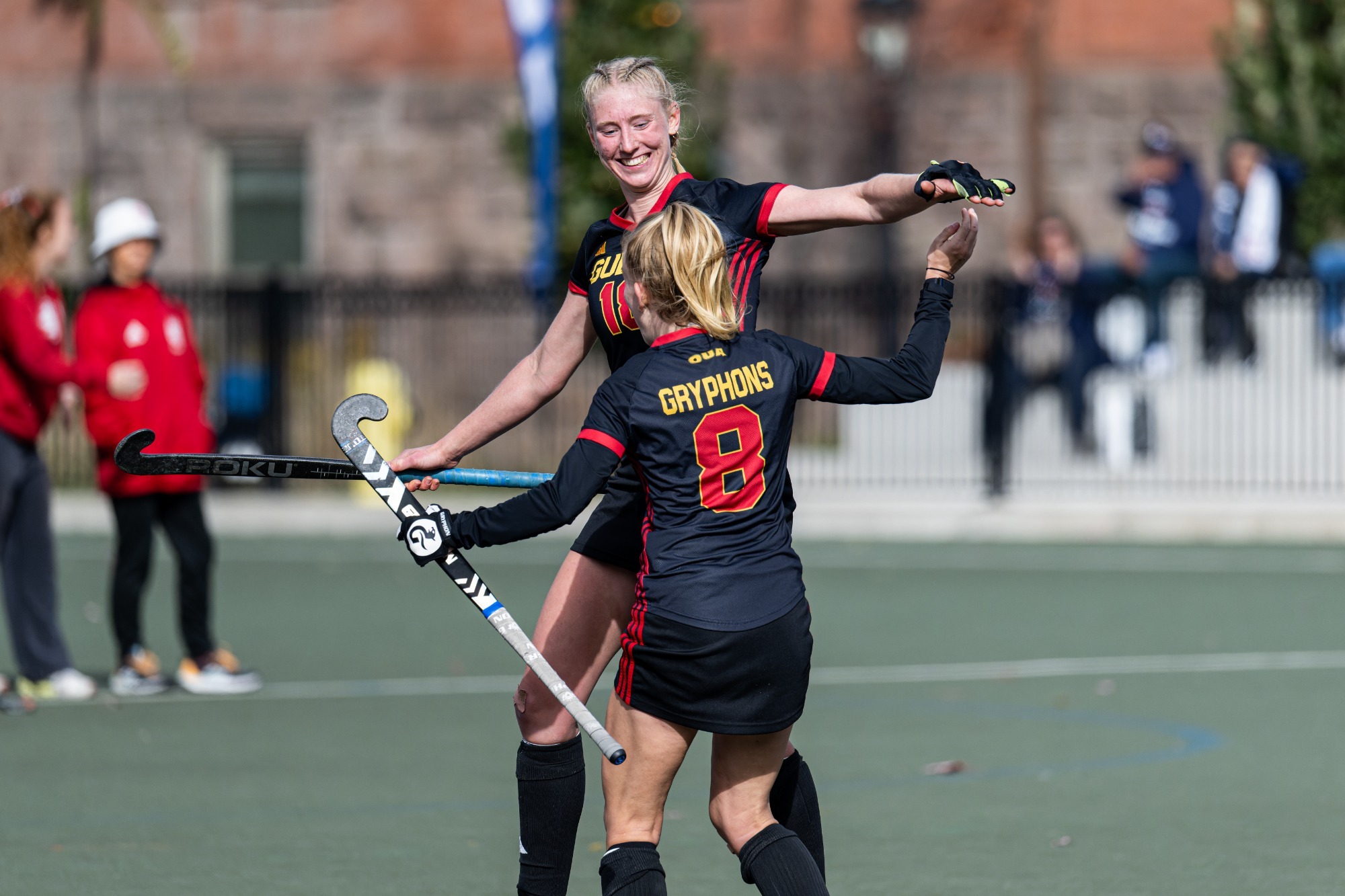 Abby Warriner celebrates with Elly Peters at 2024 OUA Field Hockey Championships
