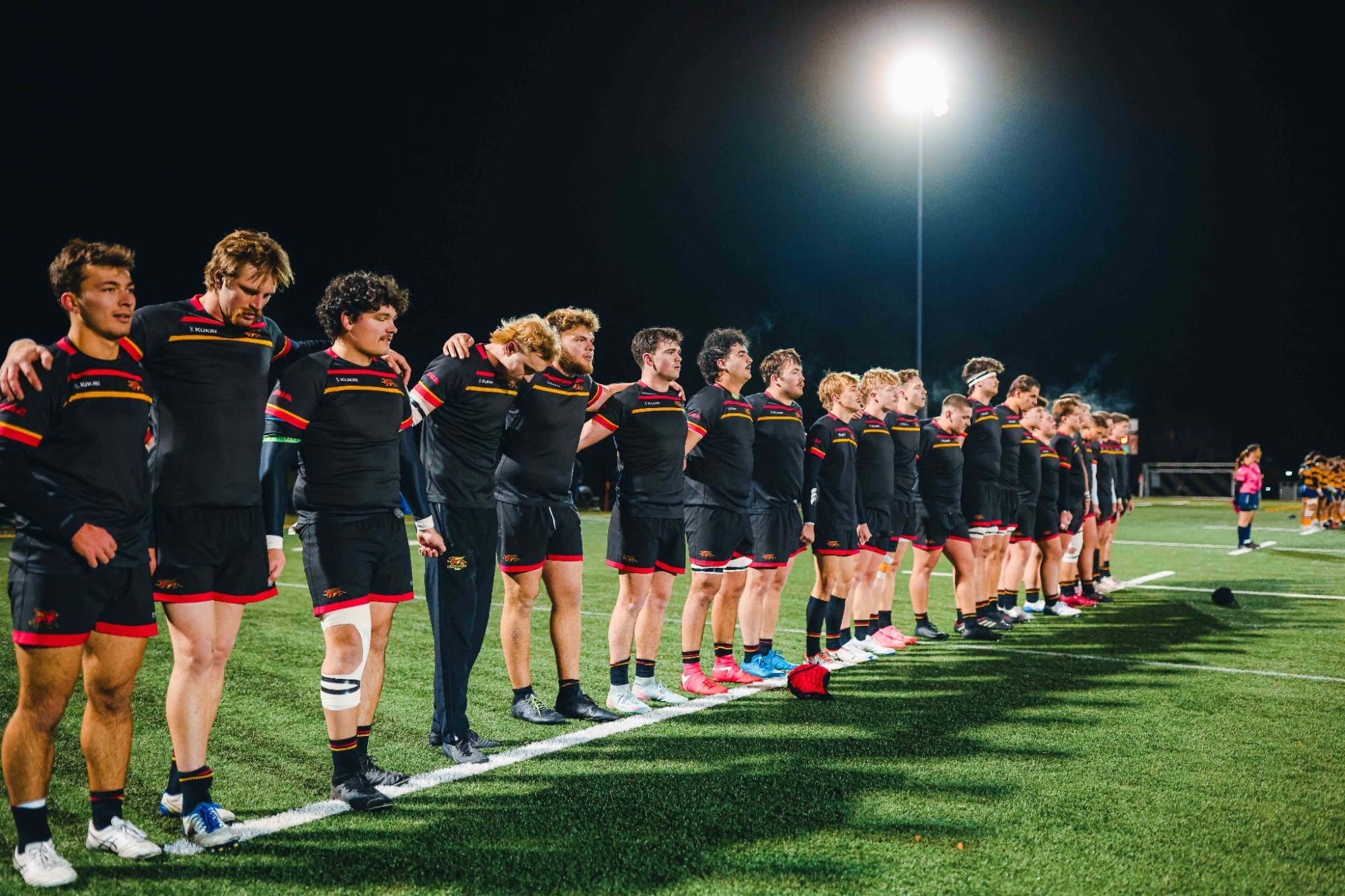 Gryphons men's rugby team lines up pre-game prior to 2025 OUA Championship vs Queen's