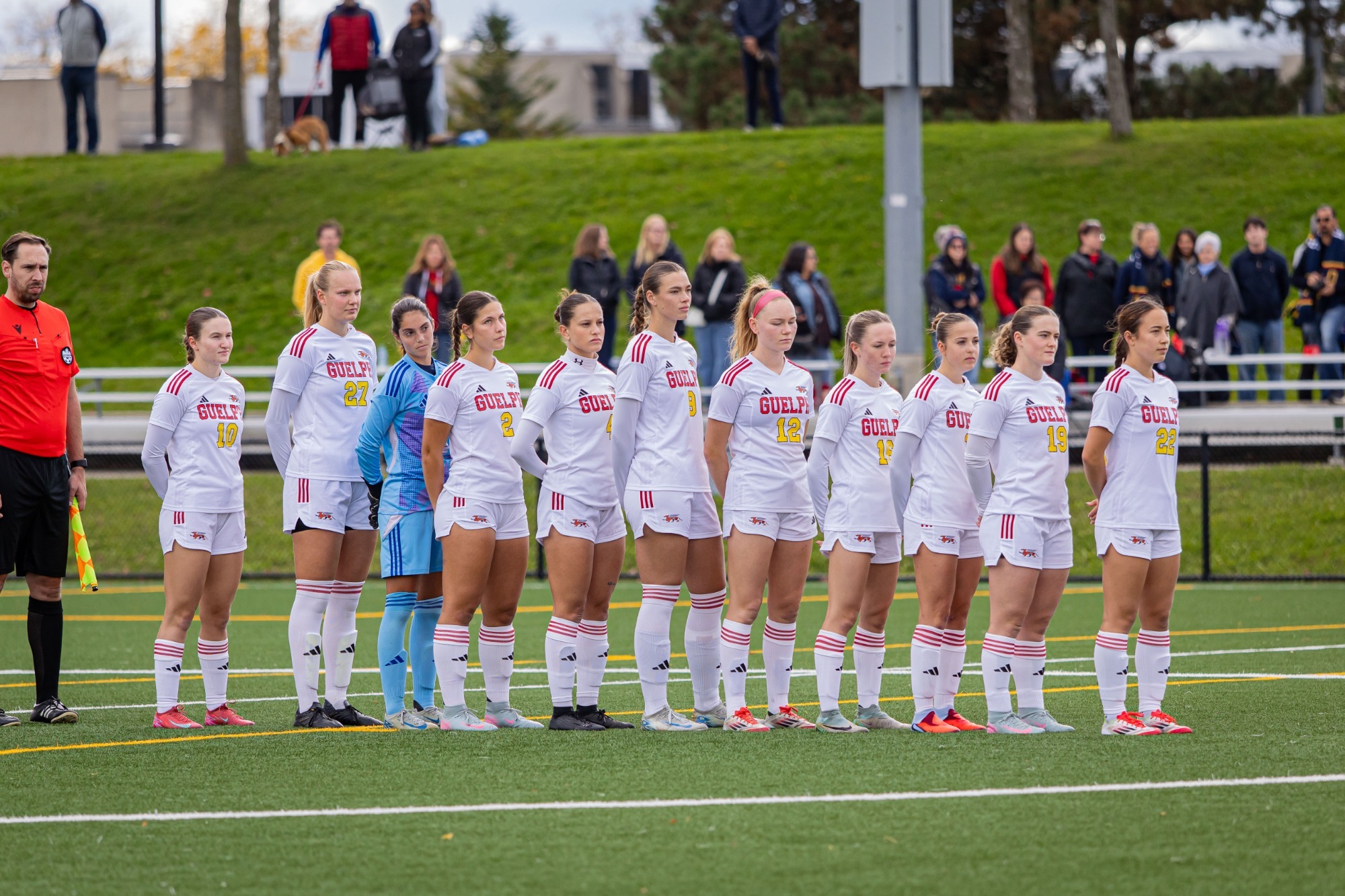 Gryphons women's soccer team lining up during national anthem prior to OUA semifinal vs Queen's