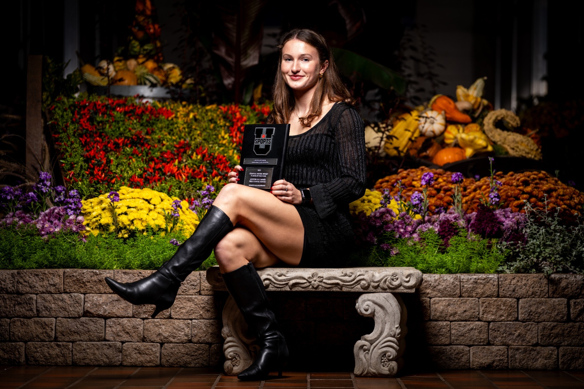 Olivia Rizakos holding Chantal Navert Award as 2025 U SPORTS Women's Soccer Player of the Year